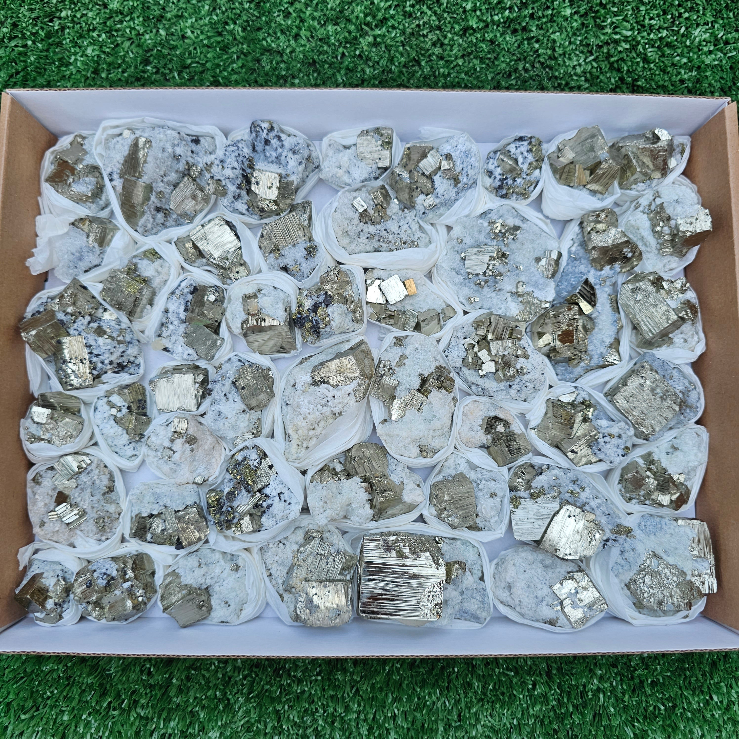 48 pc Pyrite Cubic with calcite flourecent