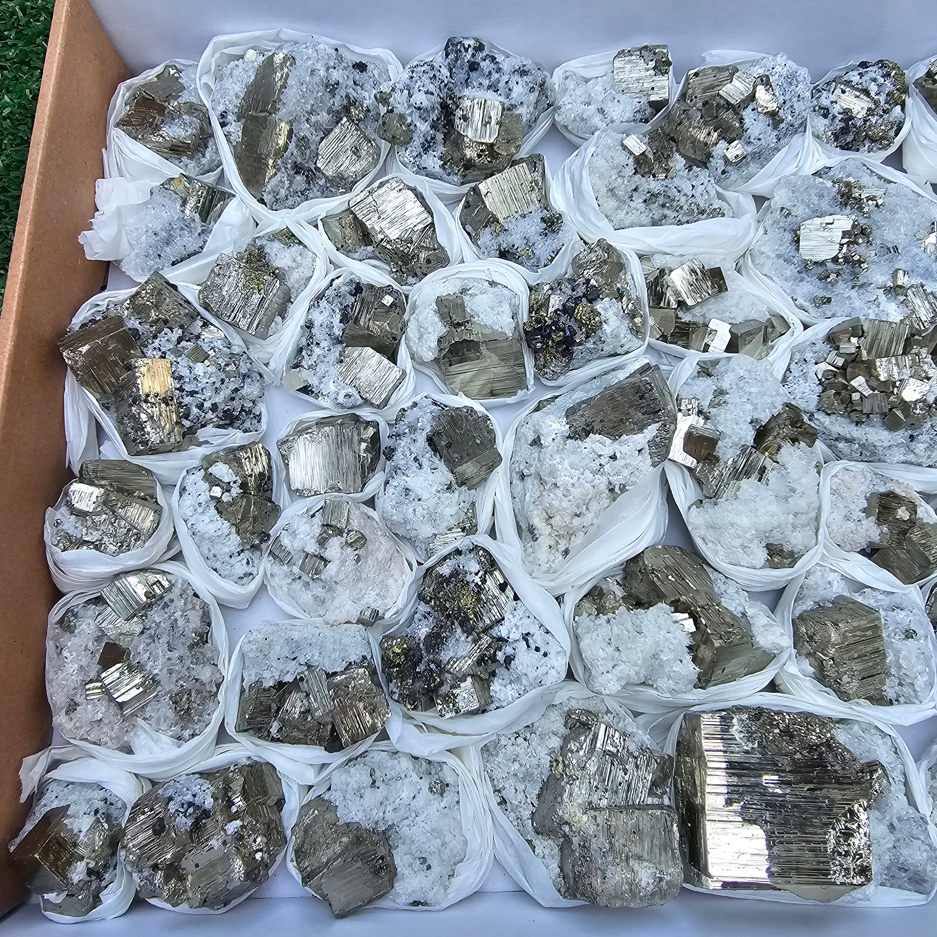 48 pc Pyrite Cubic with calcite flourecent