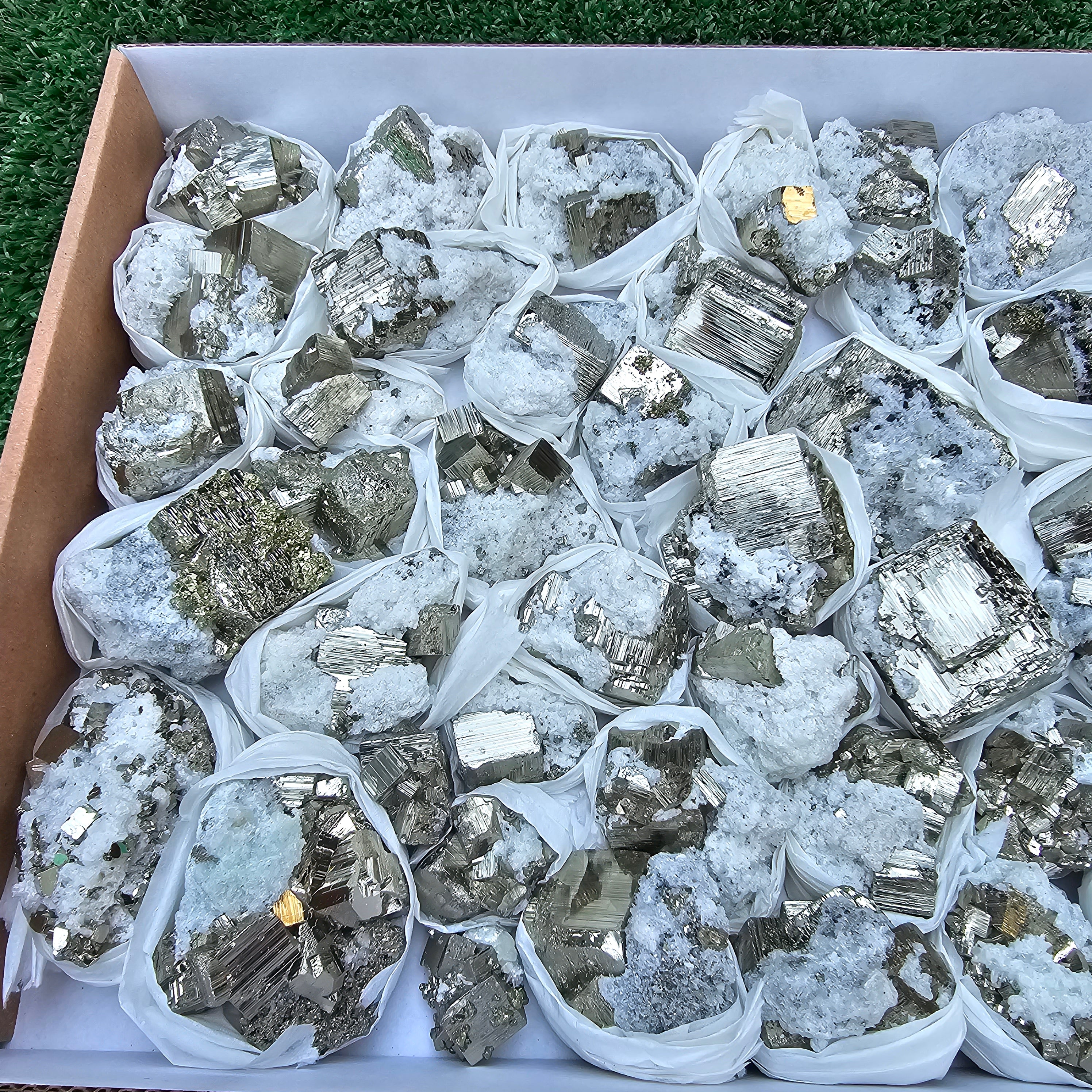 42 pc Pyrite Cubic with calcite flourecent