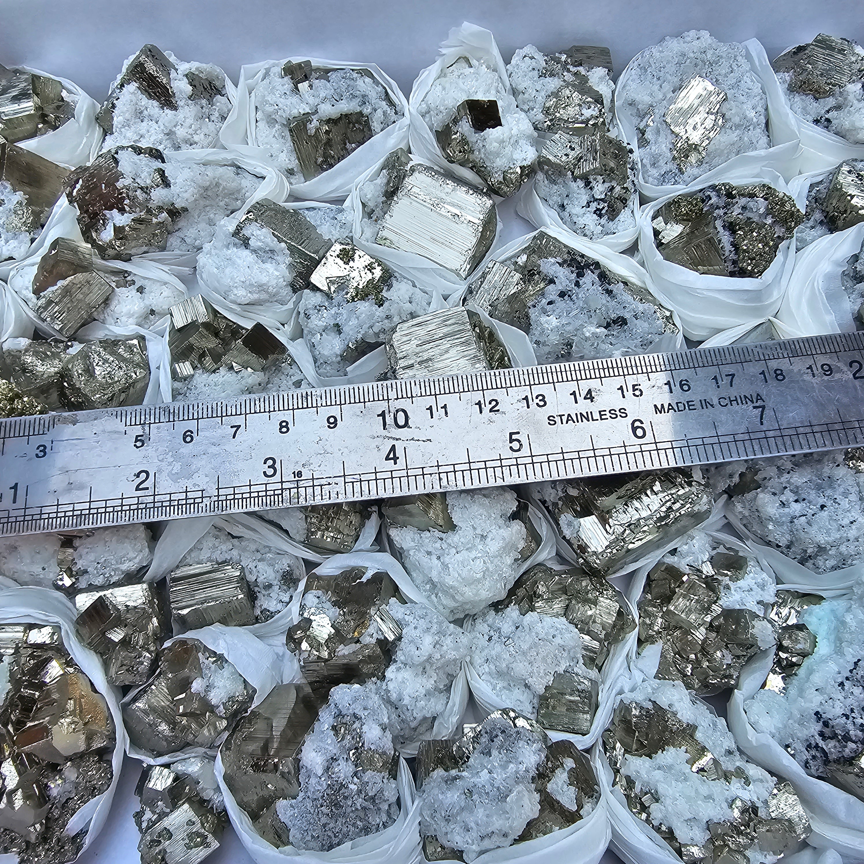 42 pc Pyrite Cubic with calcite flourecent