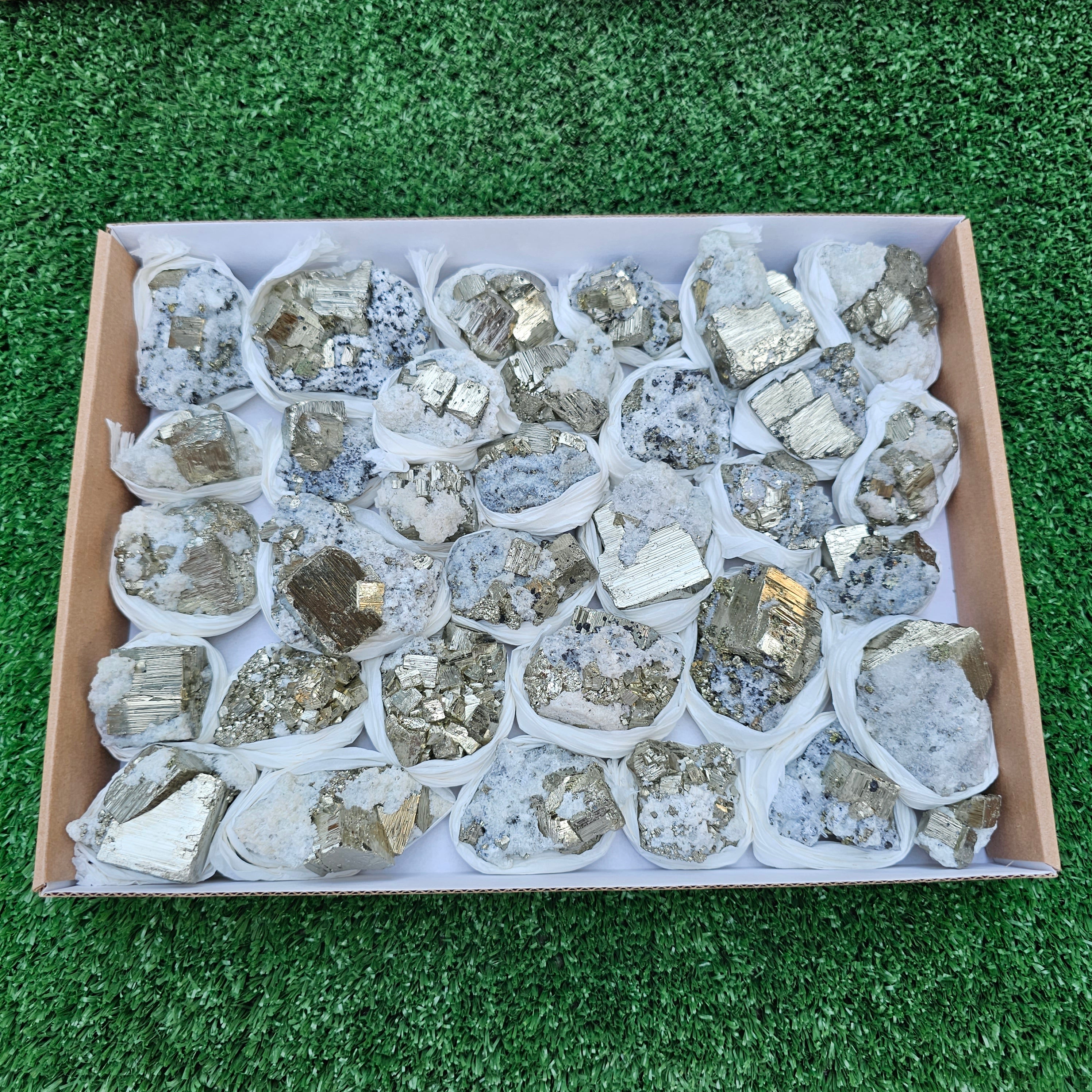 33 pc Pyrite Cubic with calcite flourecent