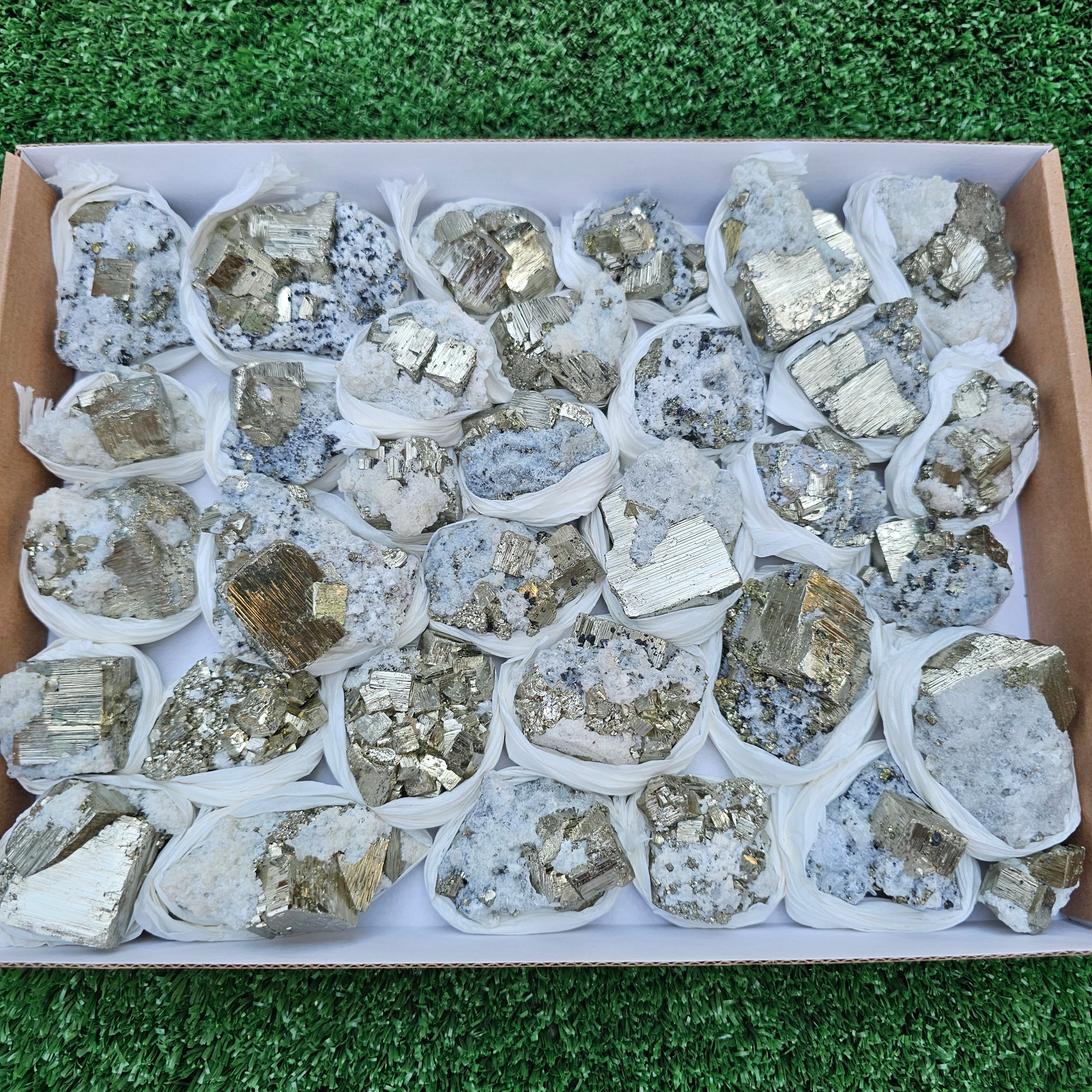 33 pc Pyrite Cubic with calcite flourecent