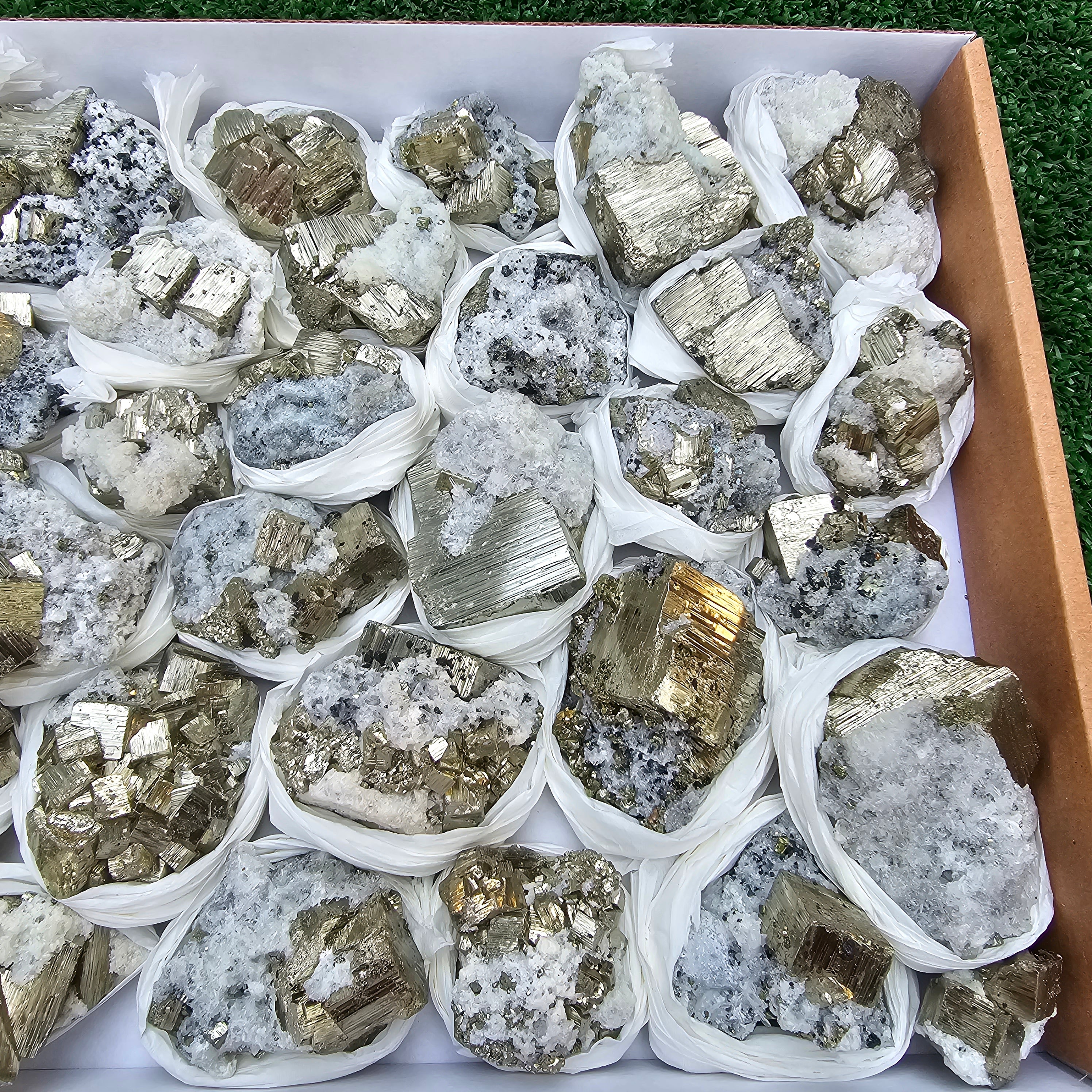 33 pc Pyrite Cubic with calcite flourecent