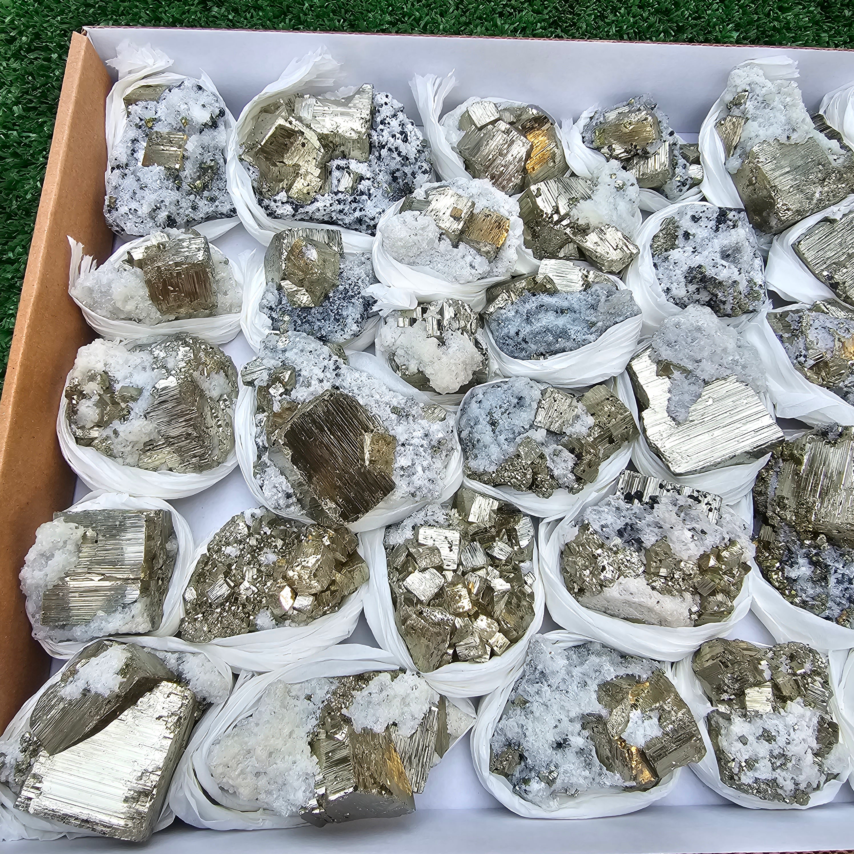 33 pc Pyrite Cubic with calcite flourecent