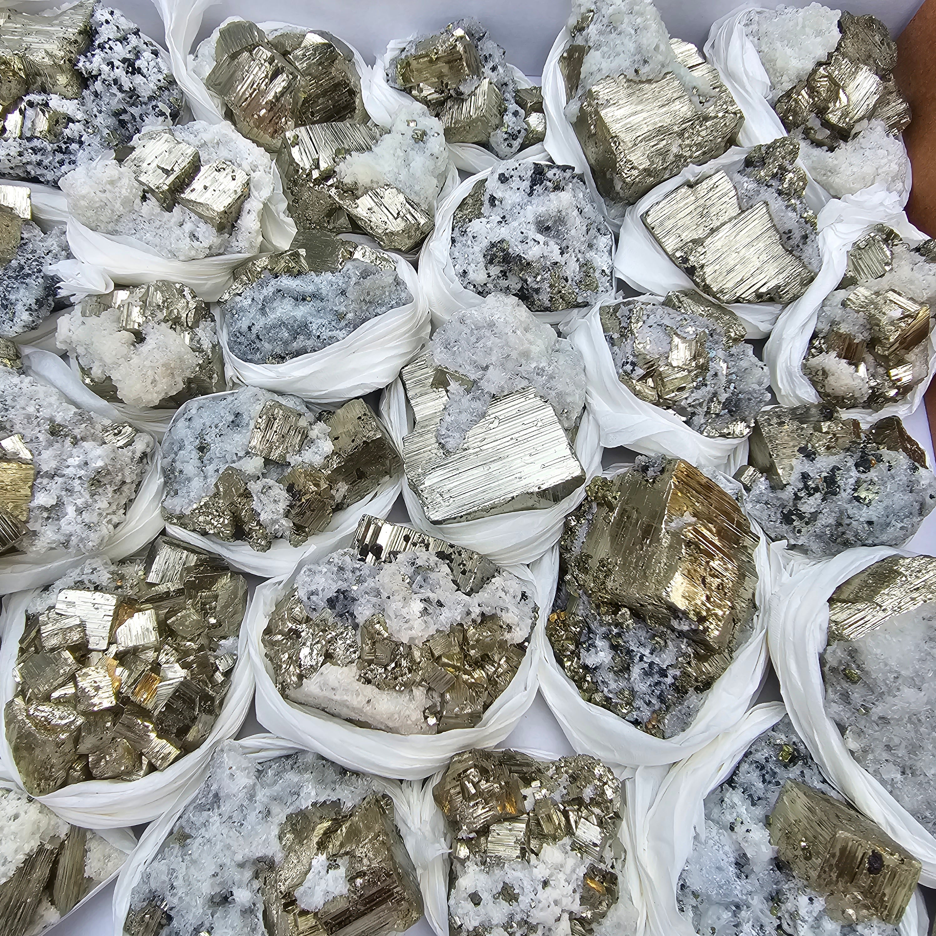 33 pc Pyrite Cubic with calcite flourecent