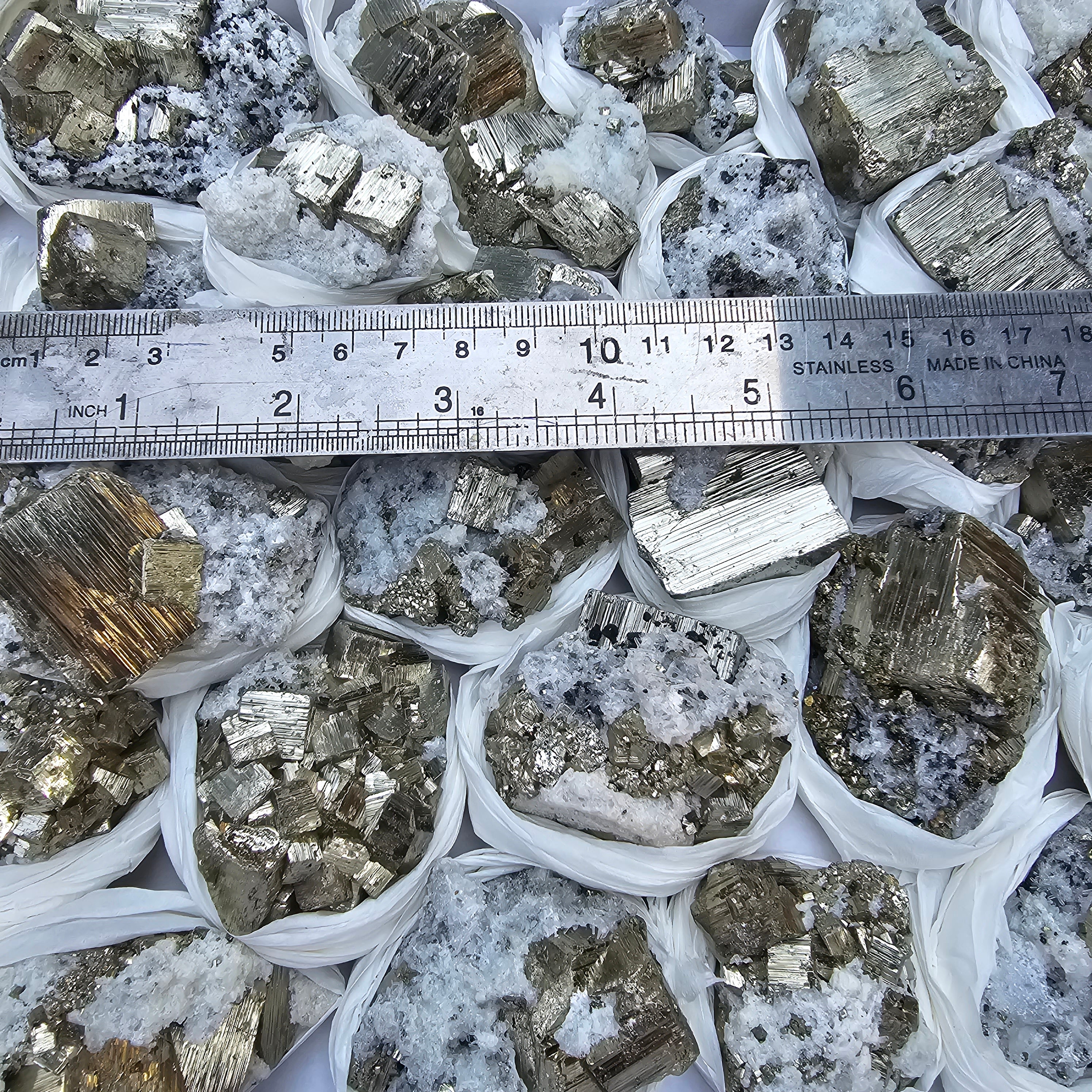 33 pc Pyrite Cubic with calcite flourecent