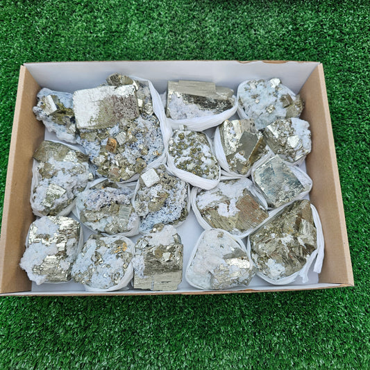 17 pc Pyrite Cubic with calcite flourecent