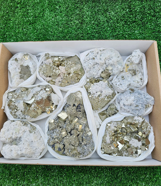 11 pc Pyrite Cubic with calcite flourecent