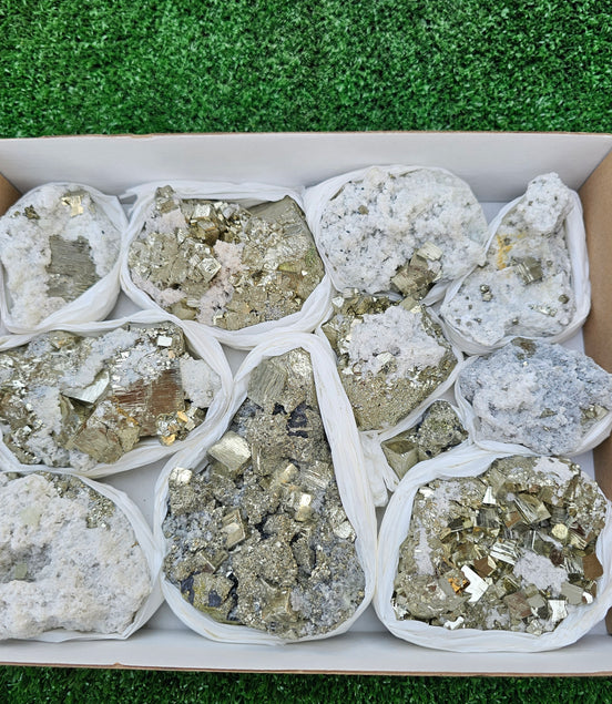 11 pc Pyrite Cubic with calcite flourecent