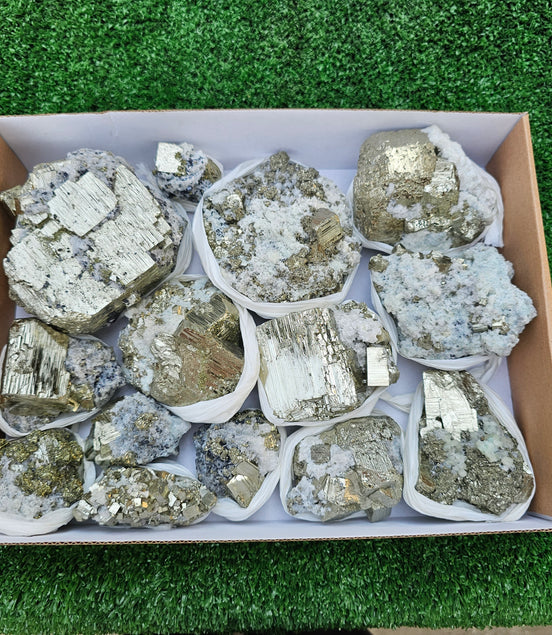 14 pc Pyrite Cubic with calcite flourecent