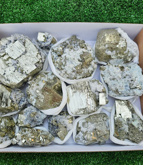 14 pc Pyrite Cubic with calcite flourecent