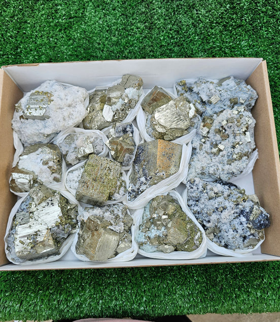 14 pc Pyrite Cubic with calcite flourecent