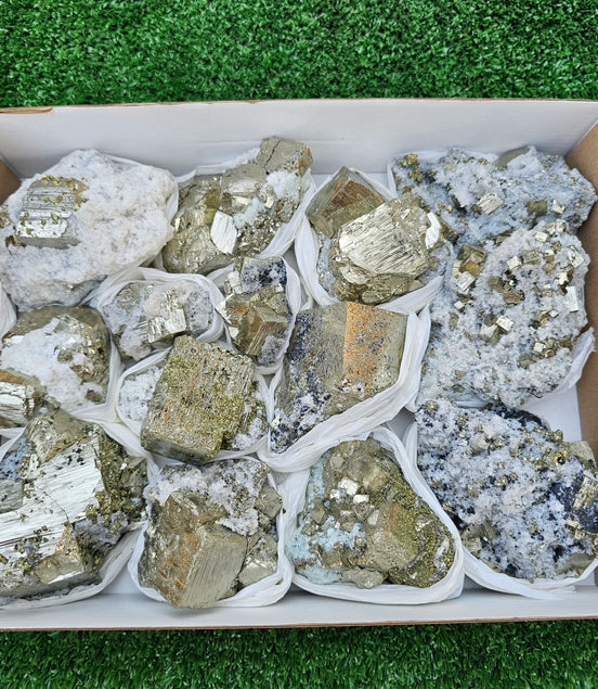 14 pc Pyrite Cubic with calcite flourecent
