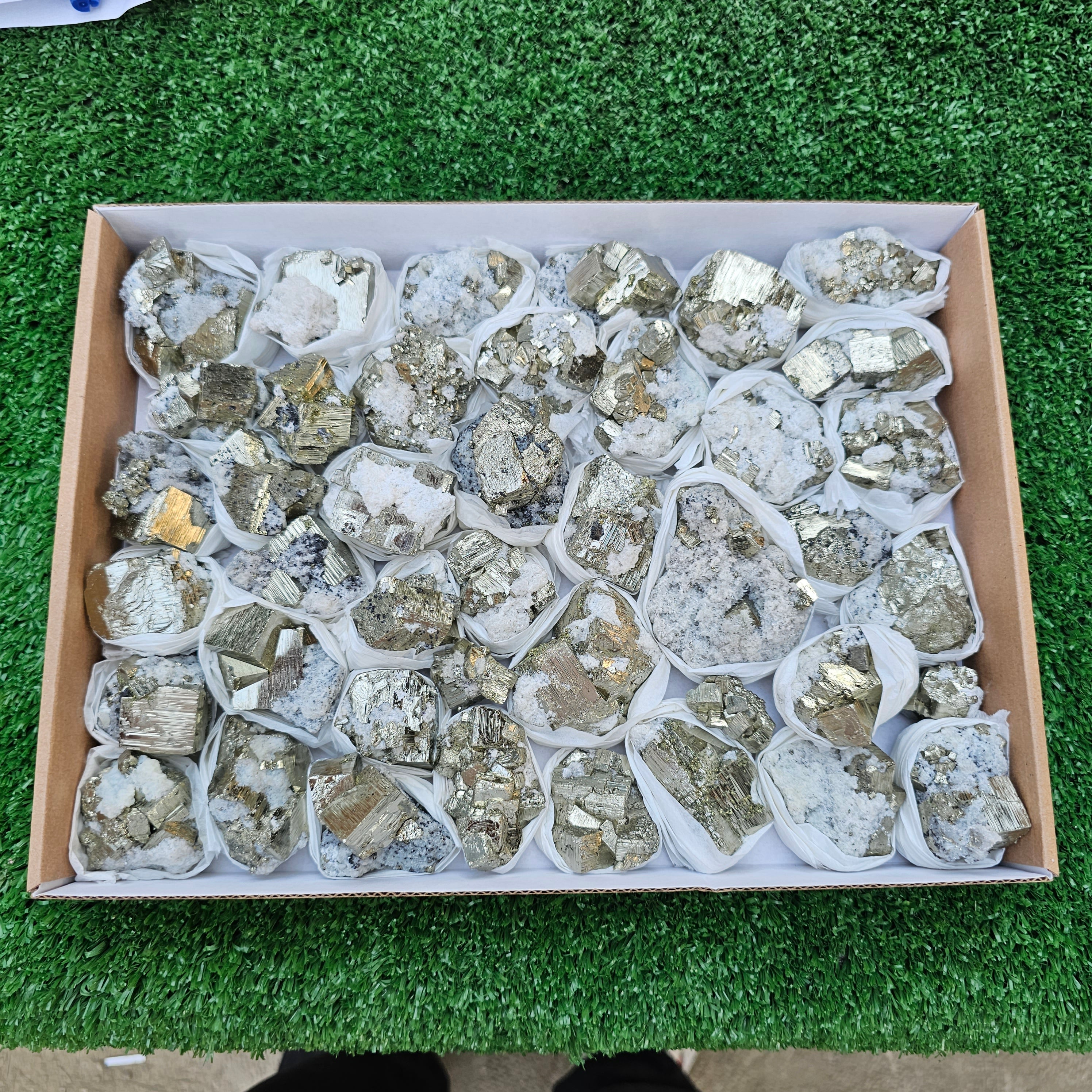 41 pc Pyrite Cubic with calcite flourecent