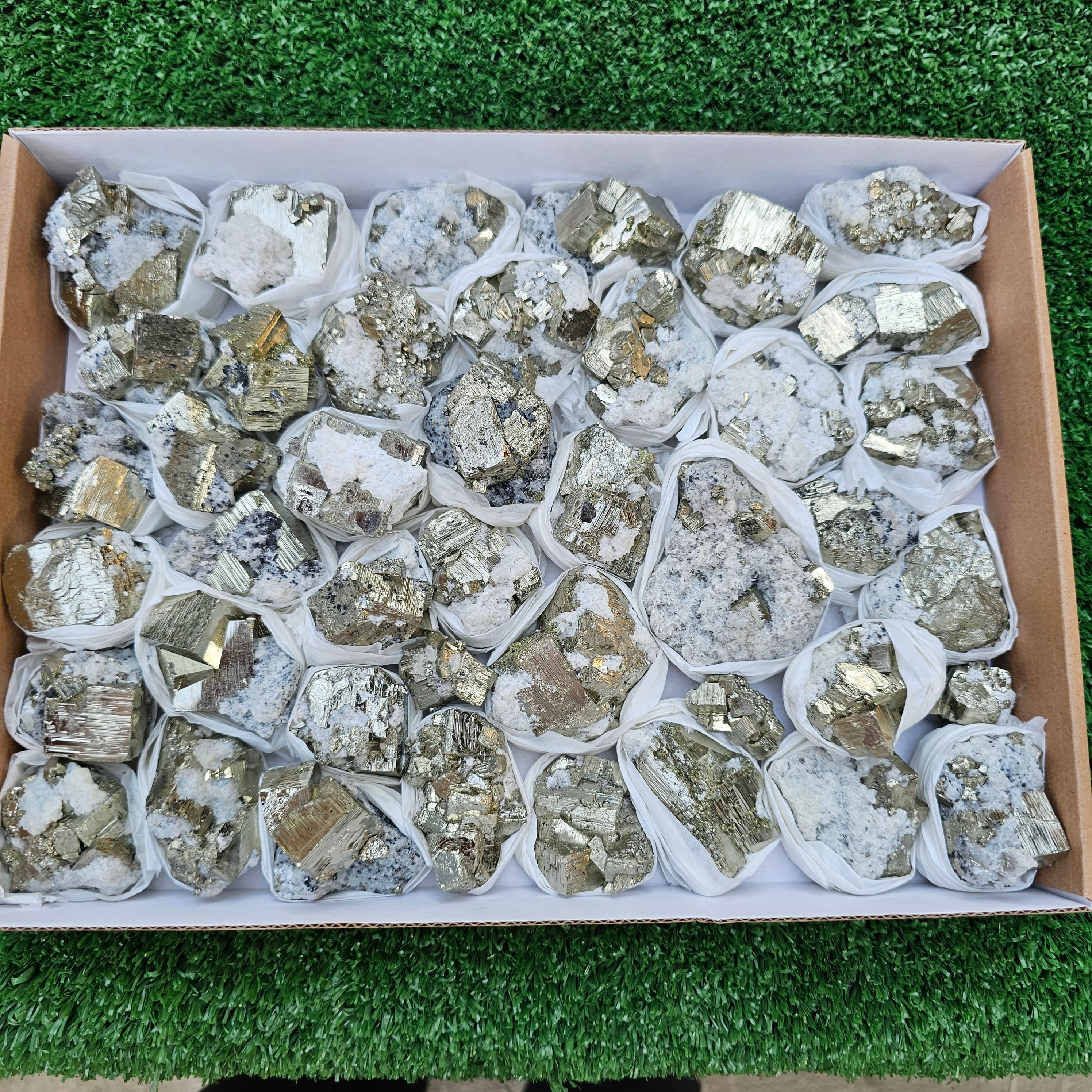41 pc Pyrite Cubic with calcite flourecent