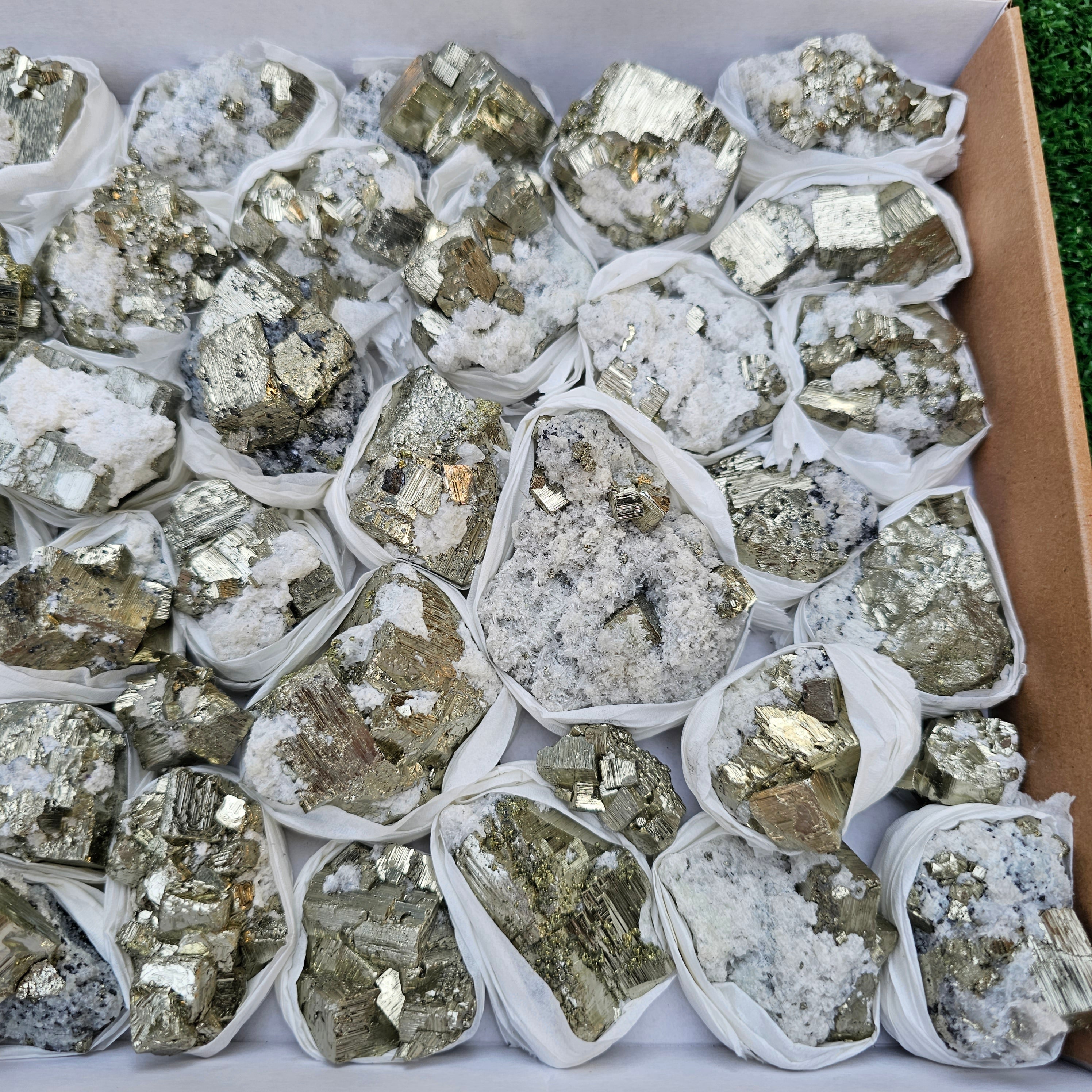41 pc Pyrite Cubic with calcite flourecent