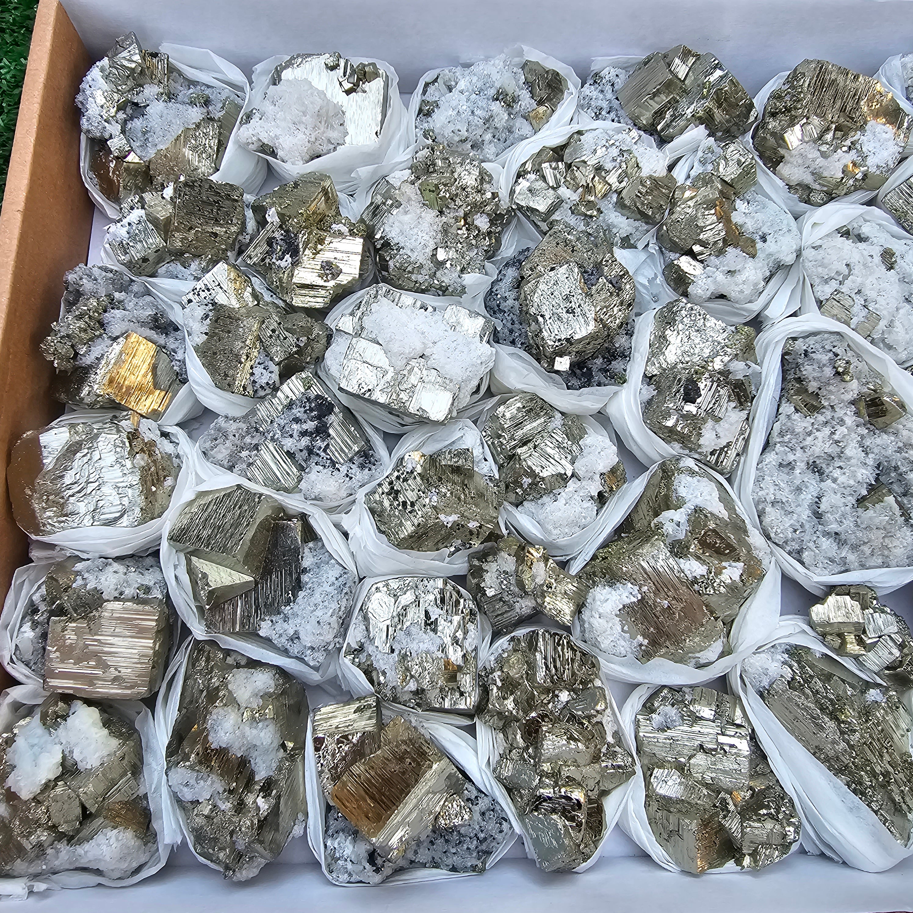 41 pc Pyrite Cubic with calcite flourecent