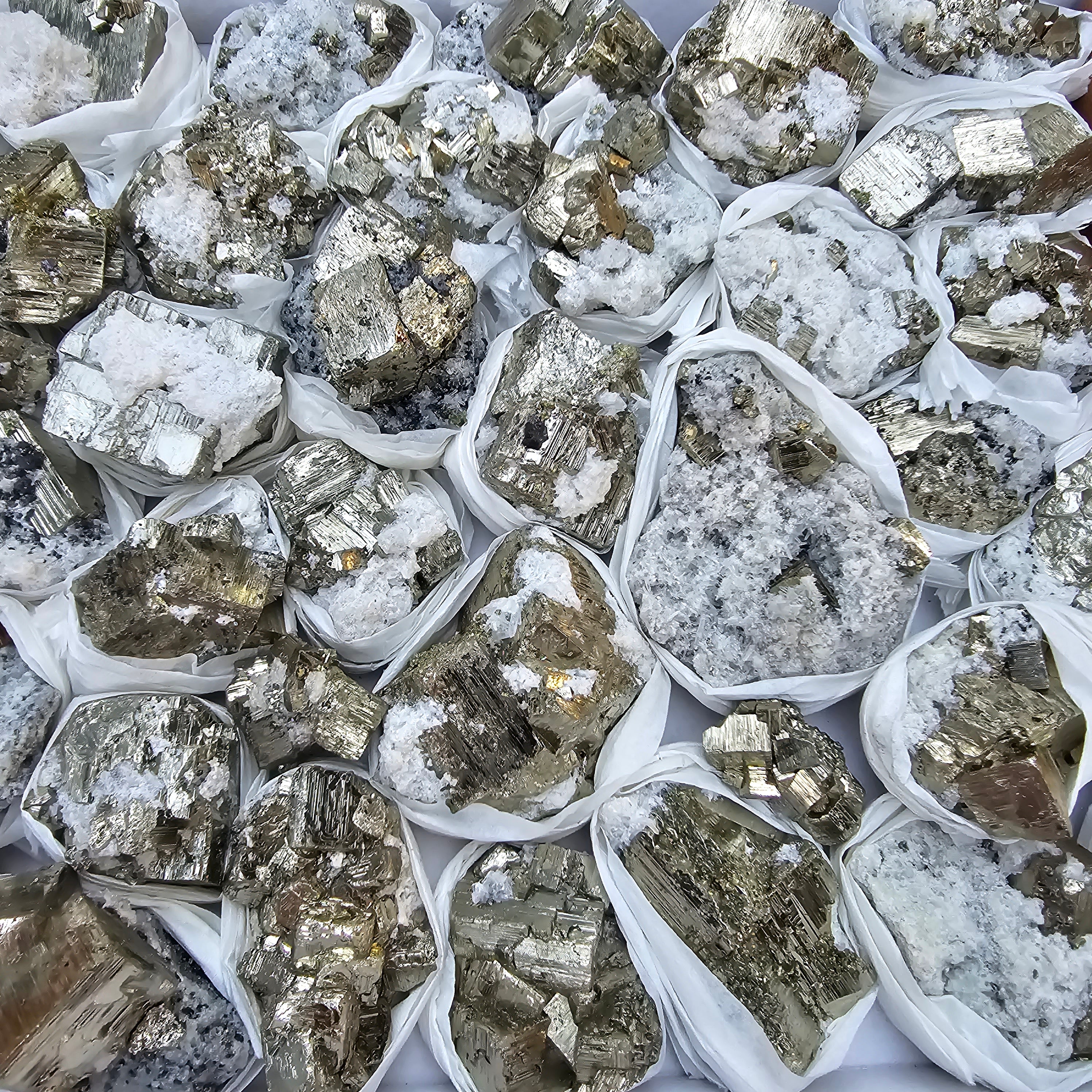 41 pc Pyrite Cubic with calcite flourecent