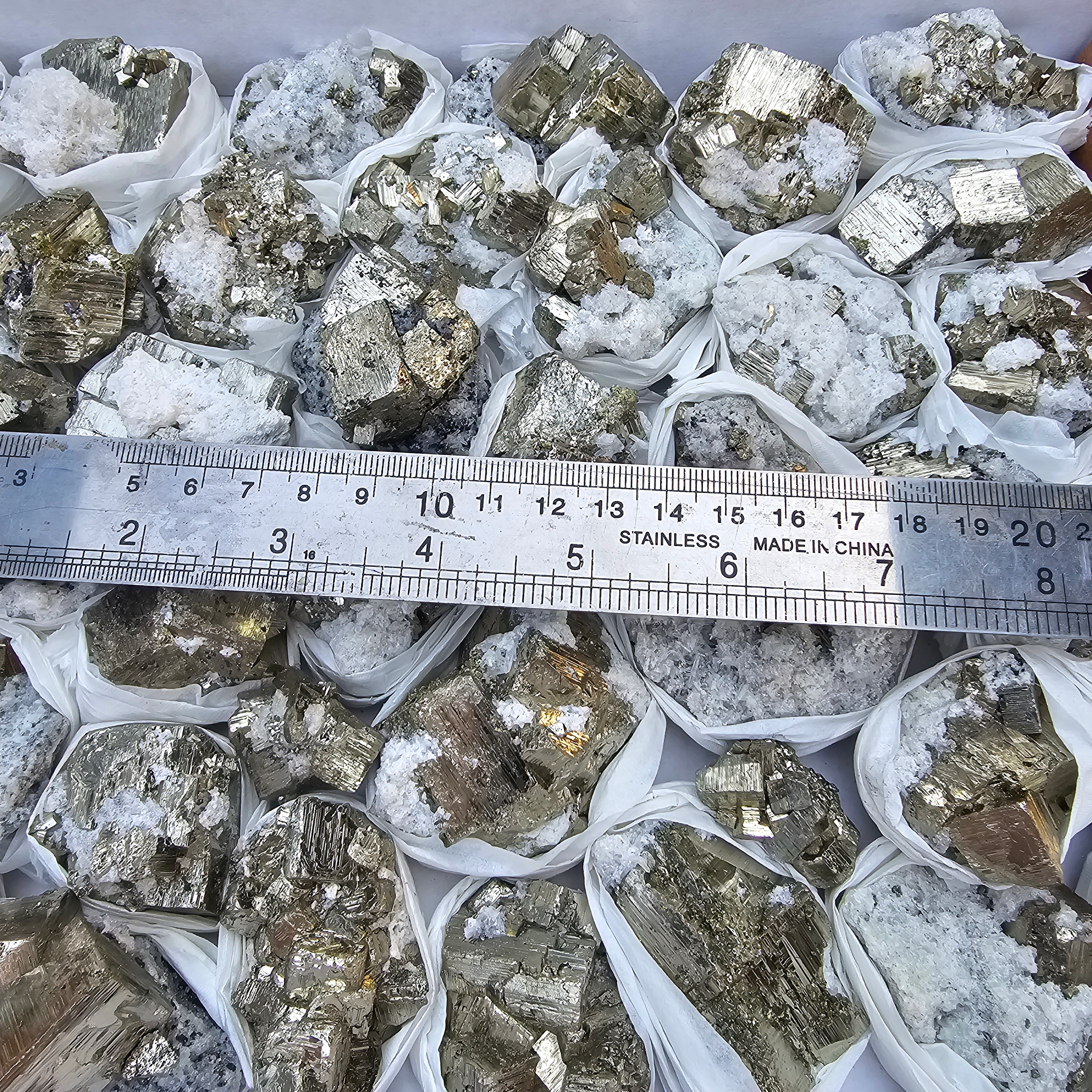41 pc Pyrite Cubic with calcite flourecent