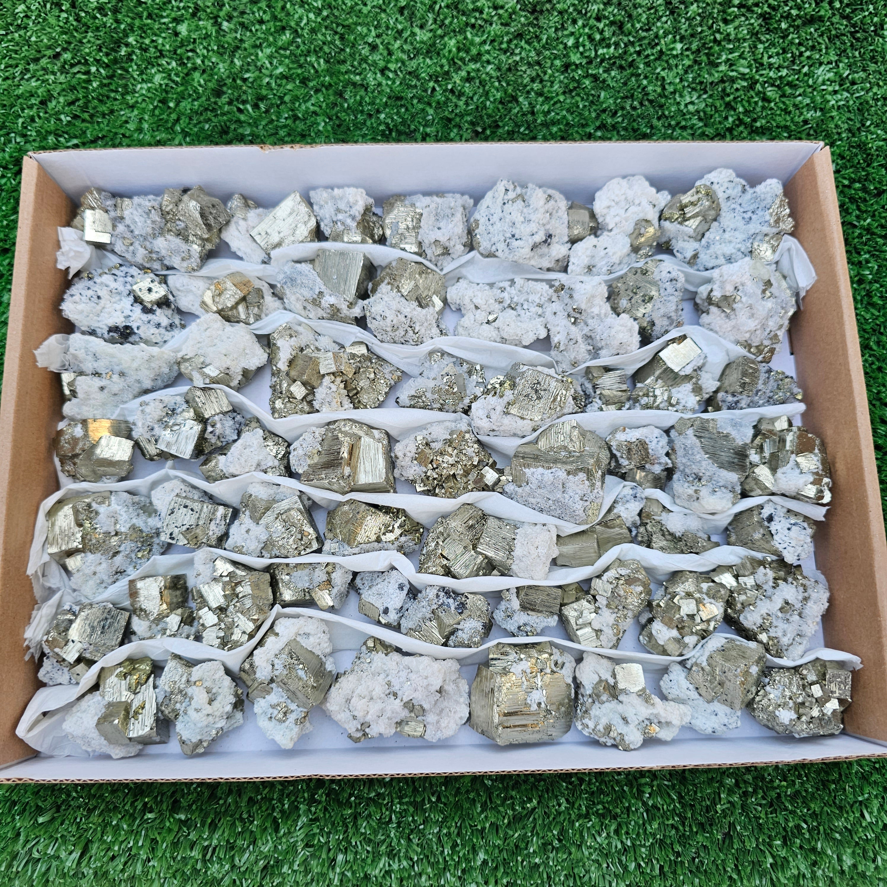 58 pc Pyrite Cubic with calcite flourecent