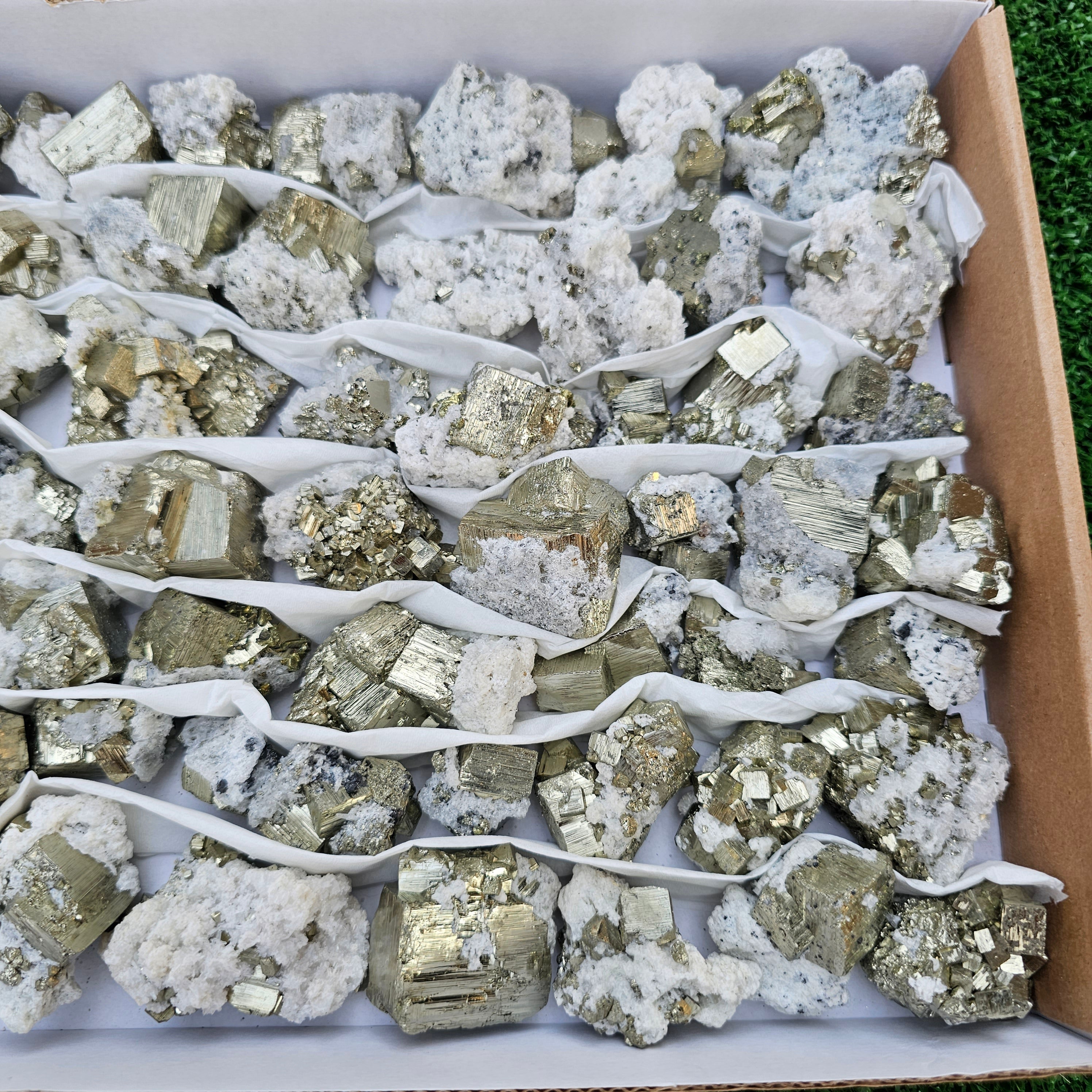 58 pc Pyrite Cubic with calcite flourecent