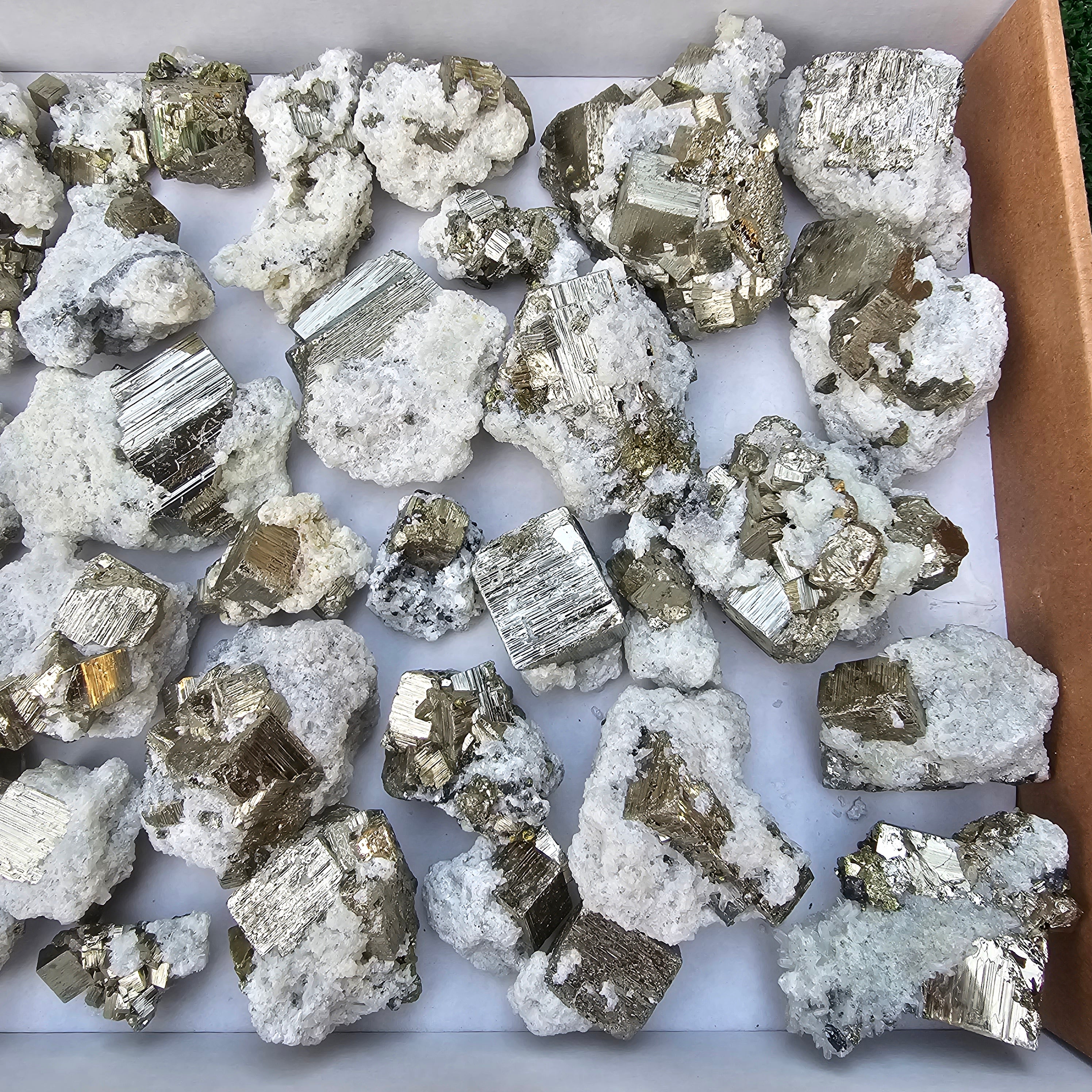 40 pc Pyrite Cubic with calcite flourecent
