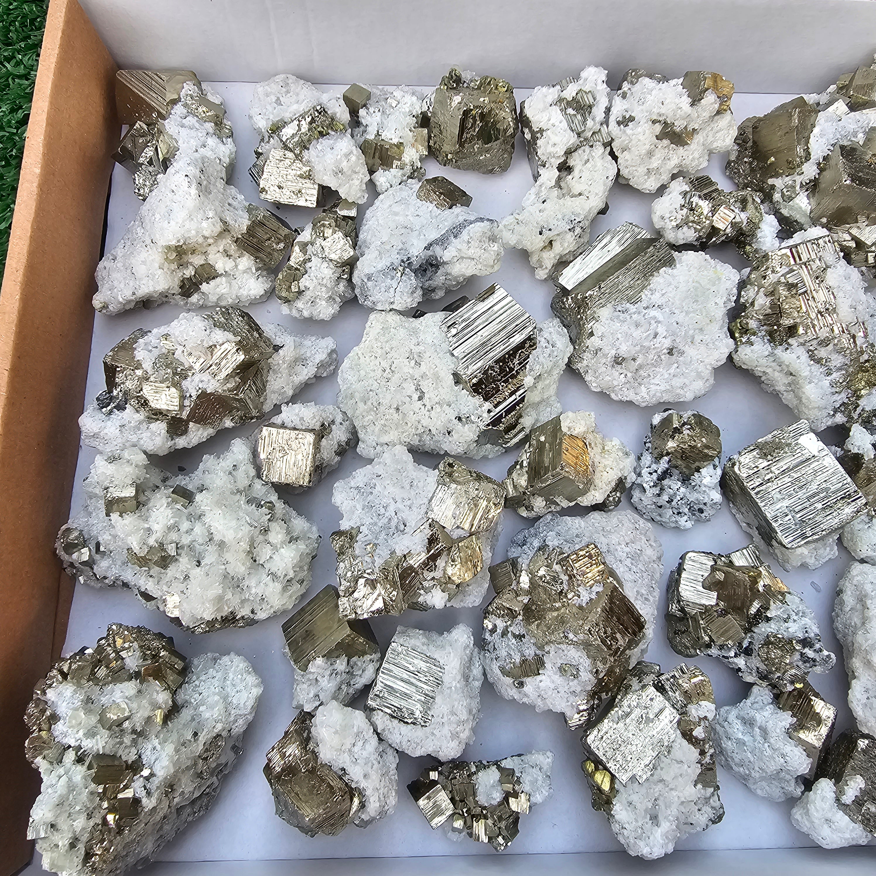 40 pc Pyrite Cubic with calcite flourecent