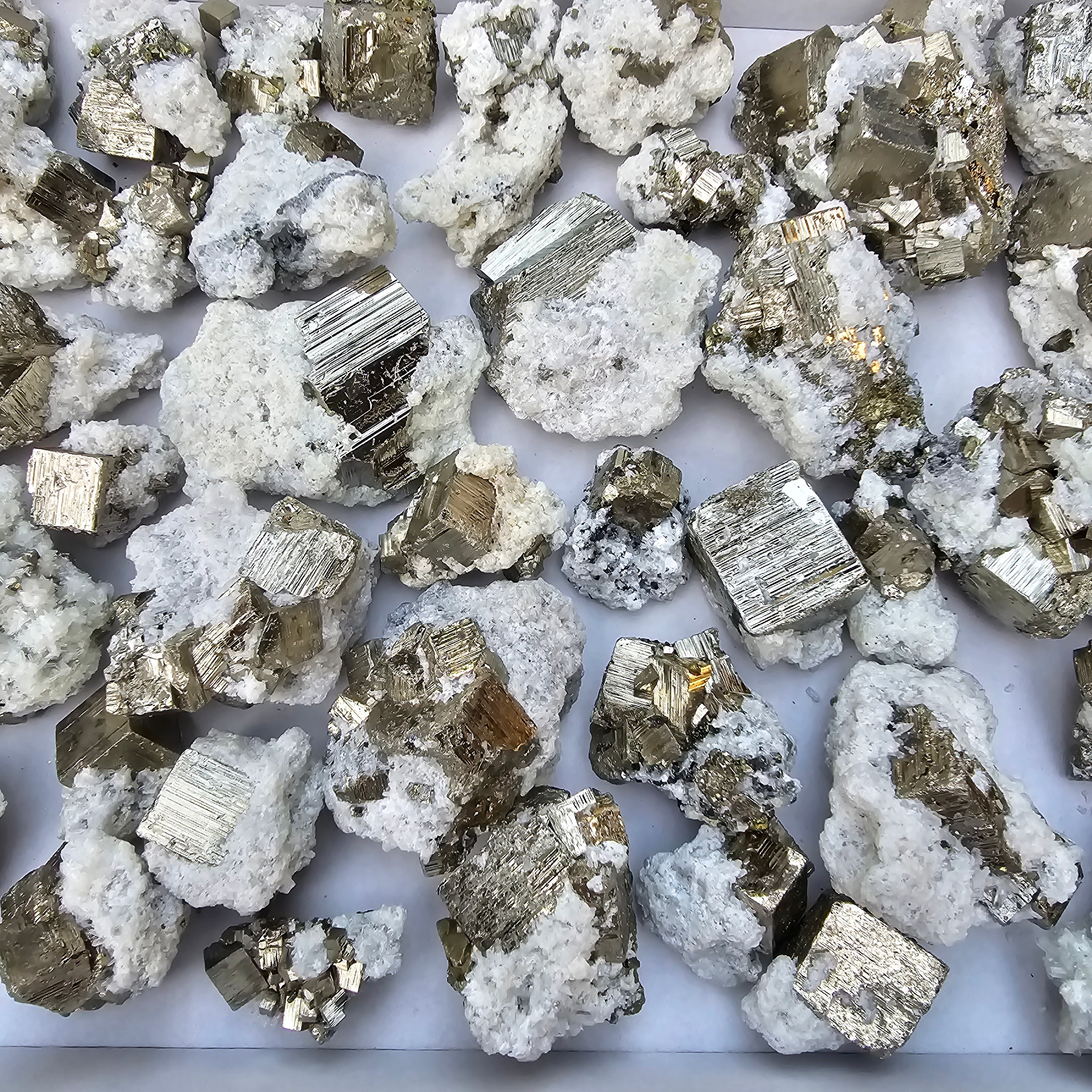 40 pc Pyrite Cubic with calcite flourecent