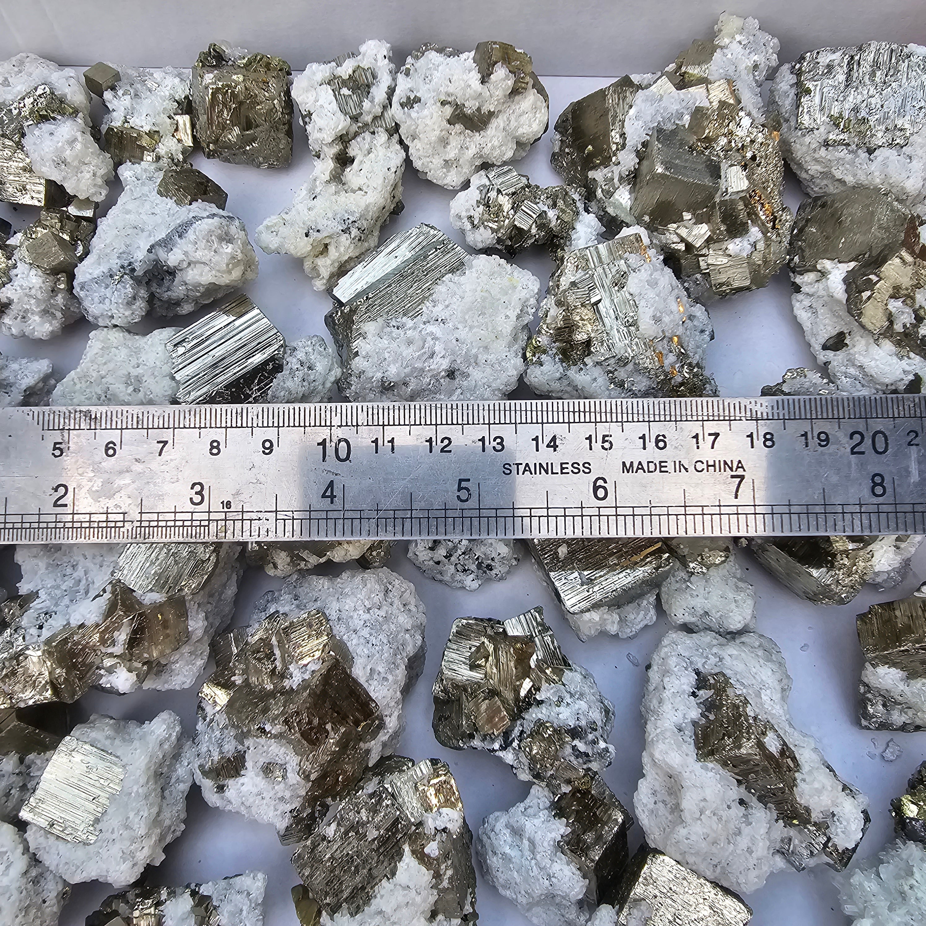 40 pc Pyrite Cubic with calcite flourecent