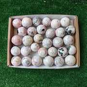 31 pc mangano calcite with rhodonite spheres