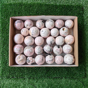 29 pc rhodonite with calcite spheres