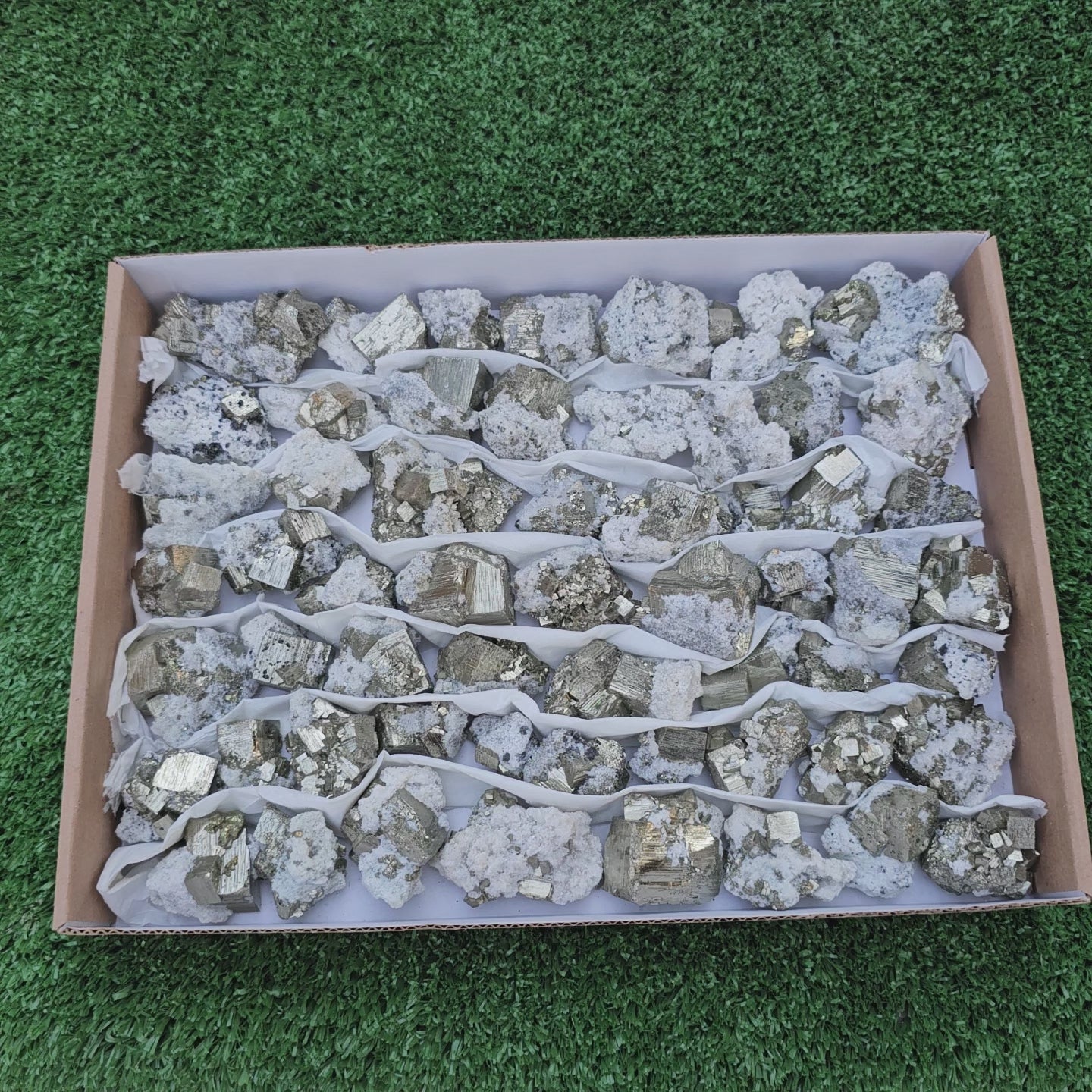 Load video: 58 pc Pyrite Cubic with calcite flourecent