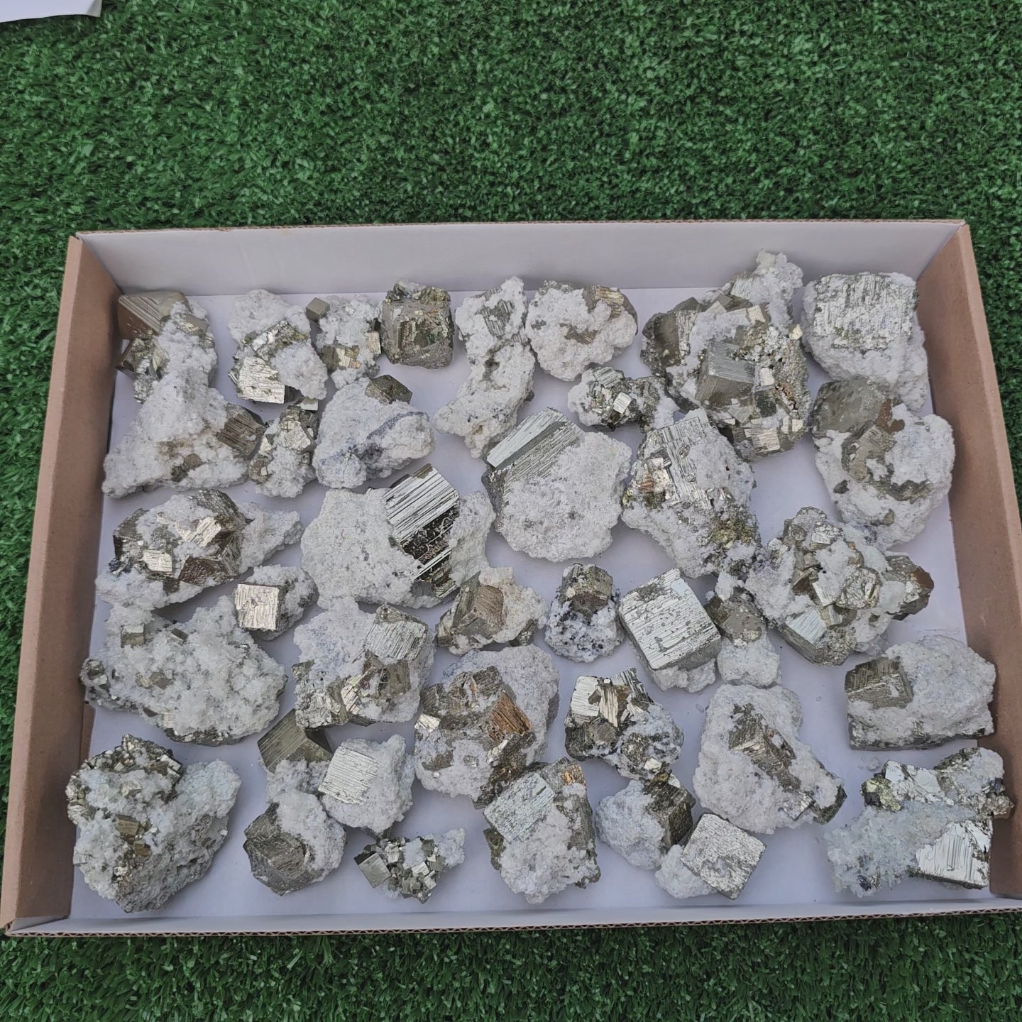 Load video: 40 pc Pyrite Cubic with calcite flourecent