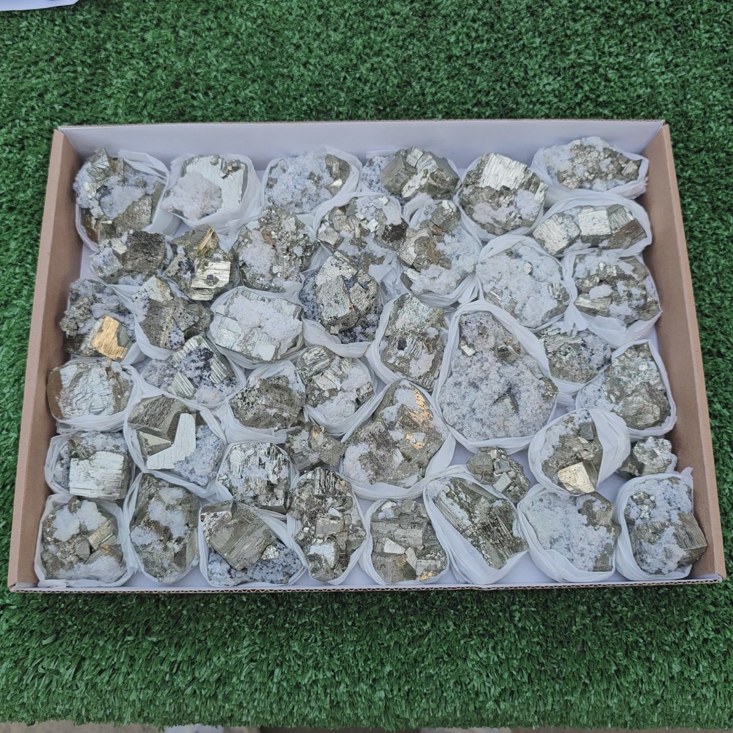 Load video: 41 pc Pyrite Cubic with calcite flourecent